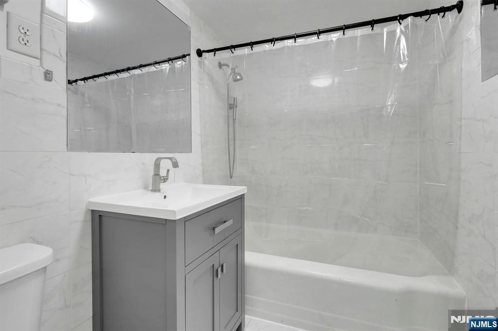 1 Horizon Road, Unit 609 Fort Lee, NJ 07024 - Photo 26 of 40 a bathroom with a shower and a sink