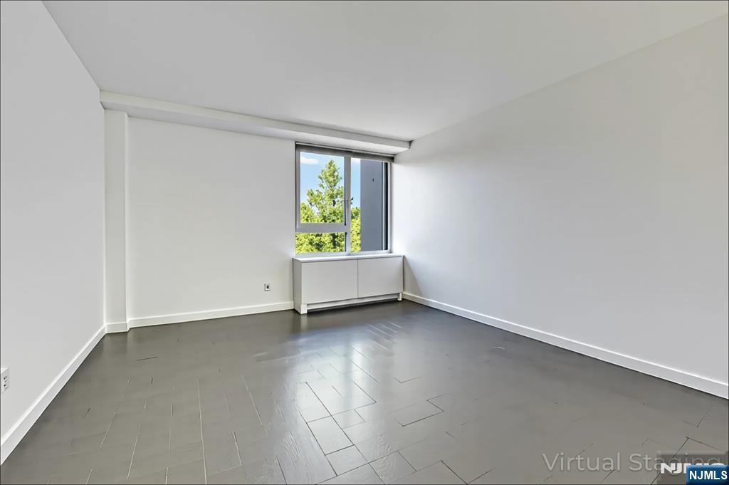 1 Horizon Road, Unit 609 Fort Lee, NJ 07024 - Photo 29 of 40 an empty room with a window