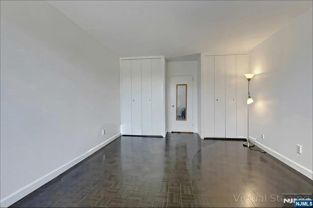 1 Horizon Road, Unit 609 Fort Lee, NJ 07024 - Photo 31 of 40 a view of an empty room and window