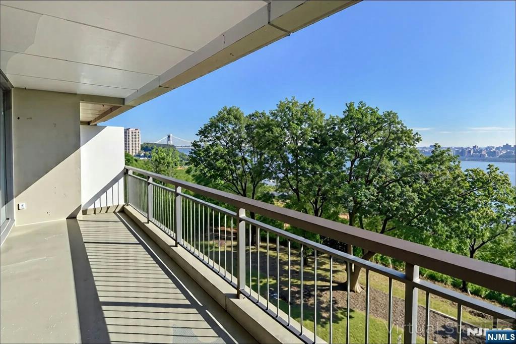 1 Horizon Road, Unit 609 Fort Lee, NJ 07024 - Photo 5 of 40 a view of balcony with wooden floor and fence