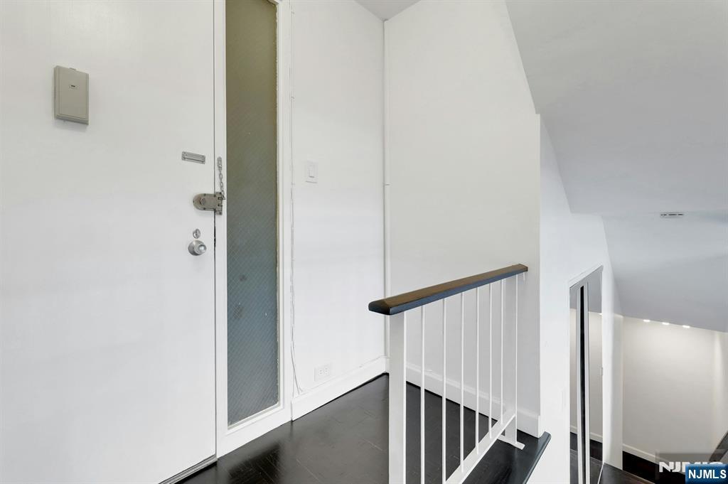 1 Horizon Road, Unit 609 Fort Lee, NJ 07024 - Photo 10 of 40 a view of a hallway with staircase