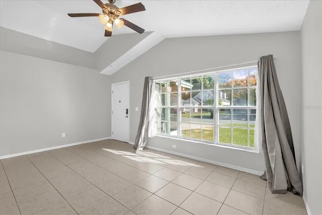 a view of an empty room with a window