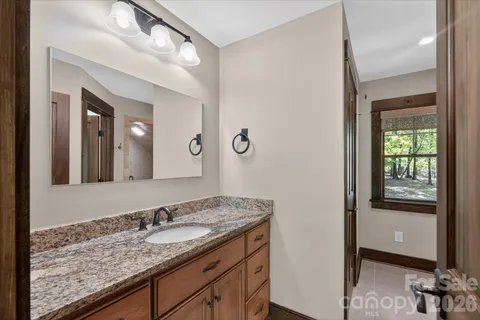 a kitchen with stainless steel appliances a refrigerator and wooden floors