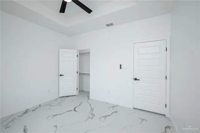 an empty space with a ceiling fan