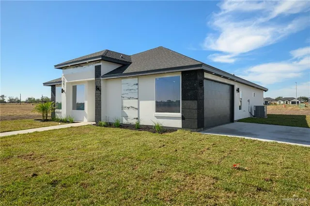 a house with yard in front of it