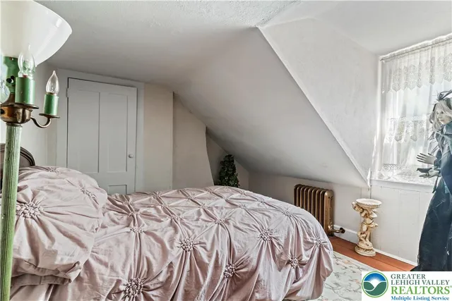a bathroom with a sink mirror and toilet