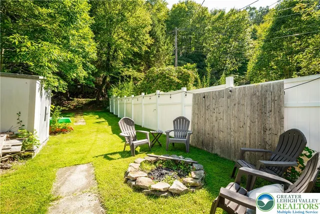 a backyard of a house with lots of green space