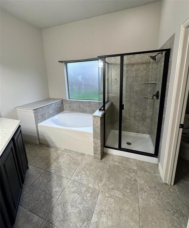 236 Archer Way Forney, TX 75126 - Photo 33 of 35 a bathroom with a tub and shower