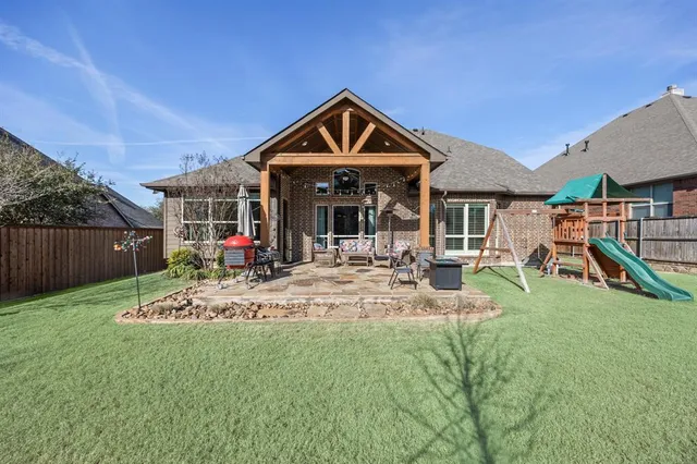a view of playground with a slide and swing