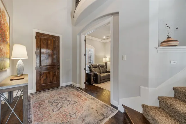 a en suite bathroom with a granite countertop sink and a mirror