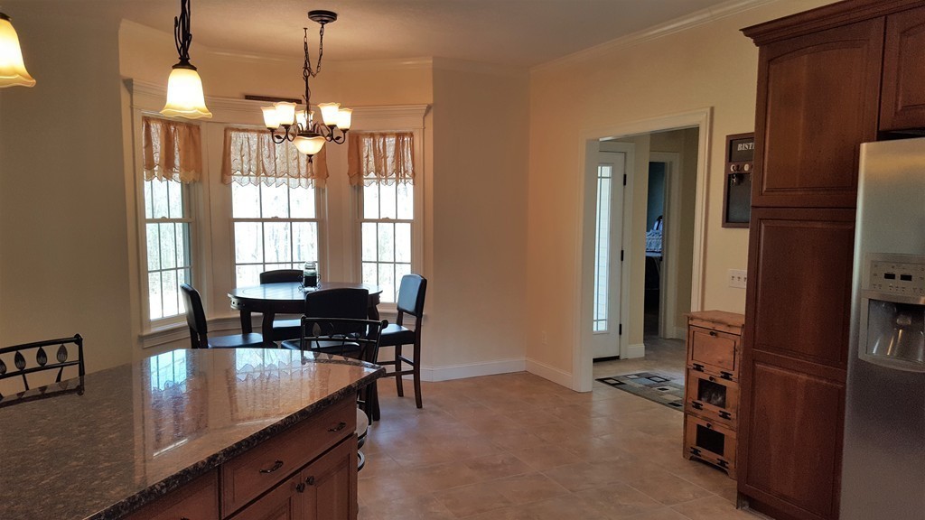 256 Hovey Road Monson, MA 01057 - Photo 19 of 27 a view of a dining room with furniture window and outside view