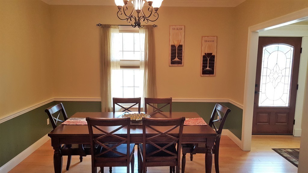 256 Hovey Road Monson, MA 01057 - Photo 9 of 27 a view of a dining room with furniture and wooden floor