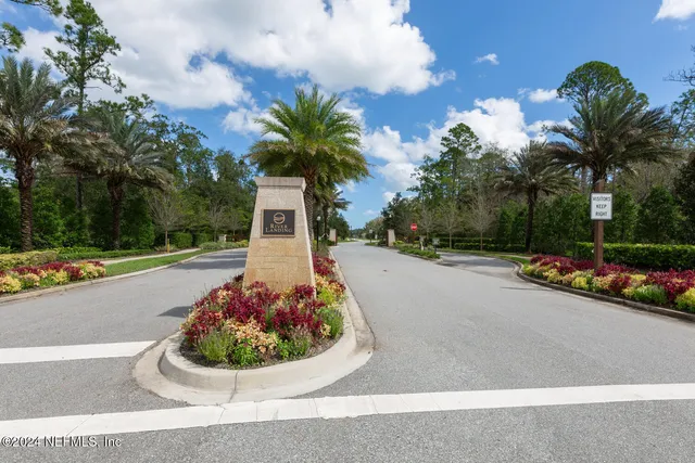 a view of a fountain in front of a house