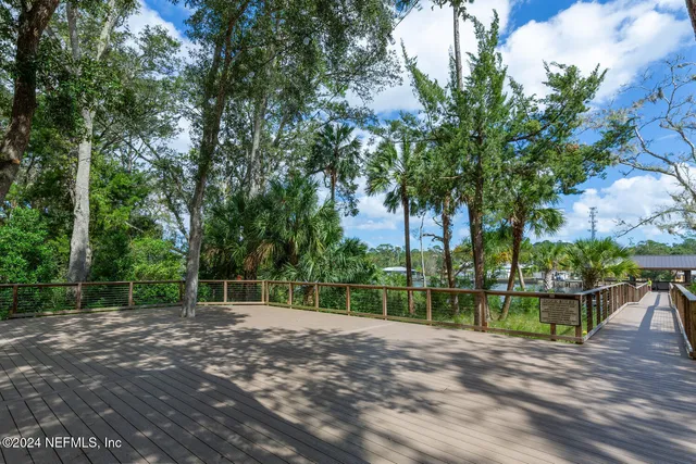 a view of a balcony with lake view and boat