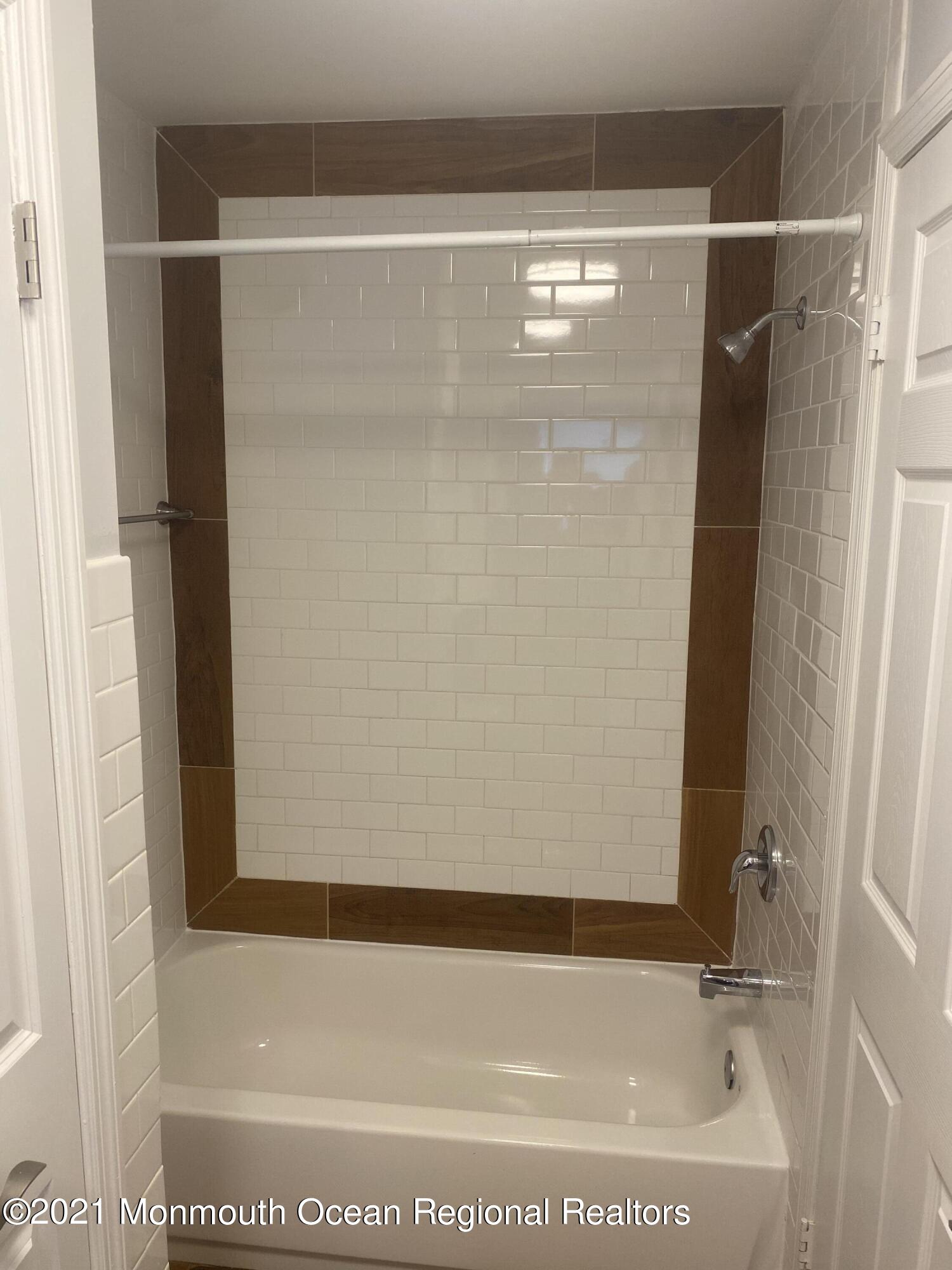 506 Harding Road, Unit 3 Freehold, NJ 07728 - Photo 15 of 18 a bathroom with a bathtub