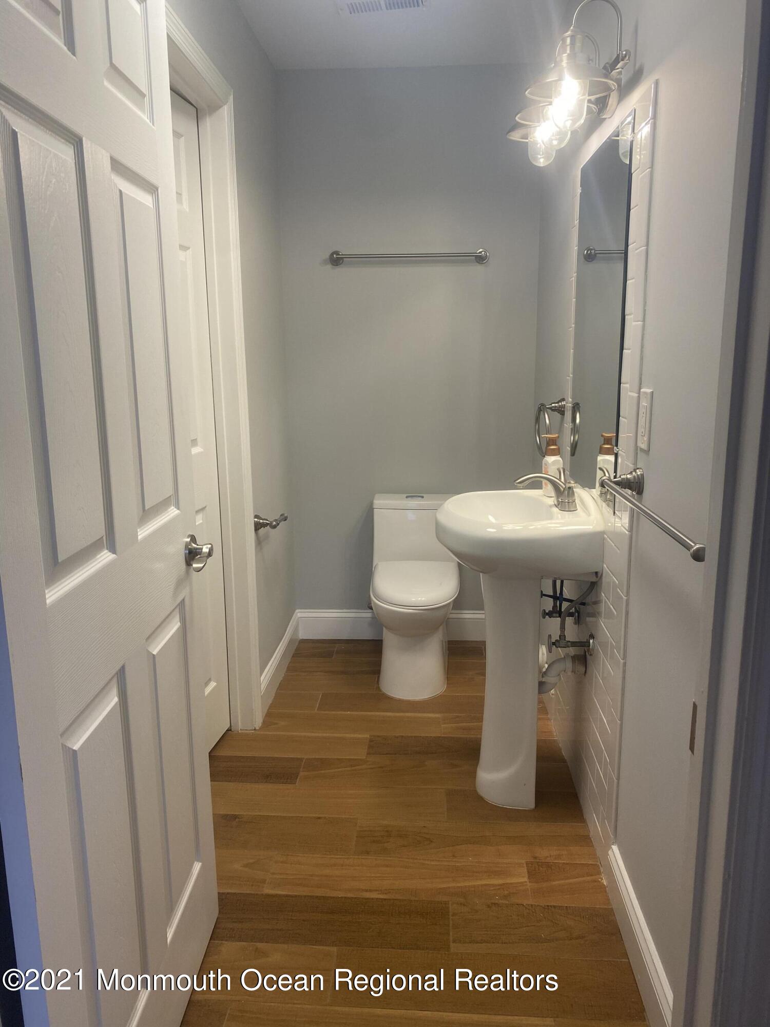 506 Harding Road, Unit 3 Freehold, NJ 07728 - Photo 17 of 18 a bathroom with a sink a toilet and shower