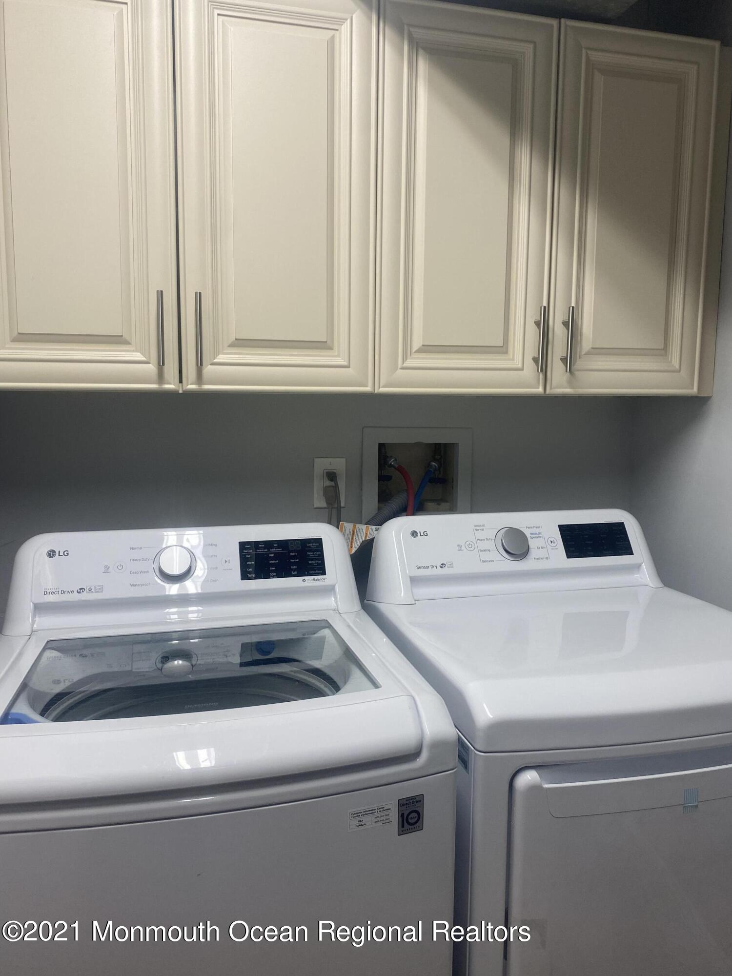 506 Harding Road, Unit 3 Freehold, NJ 07728 - Photo 18 of 18 a utility room with dryer and washer