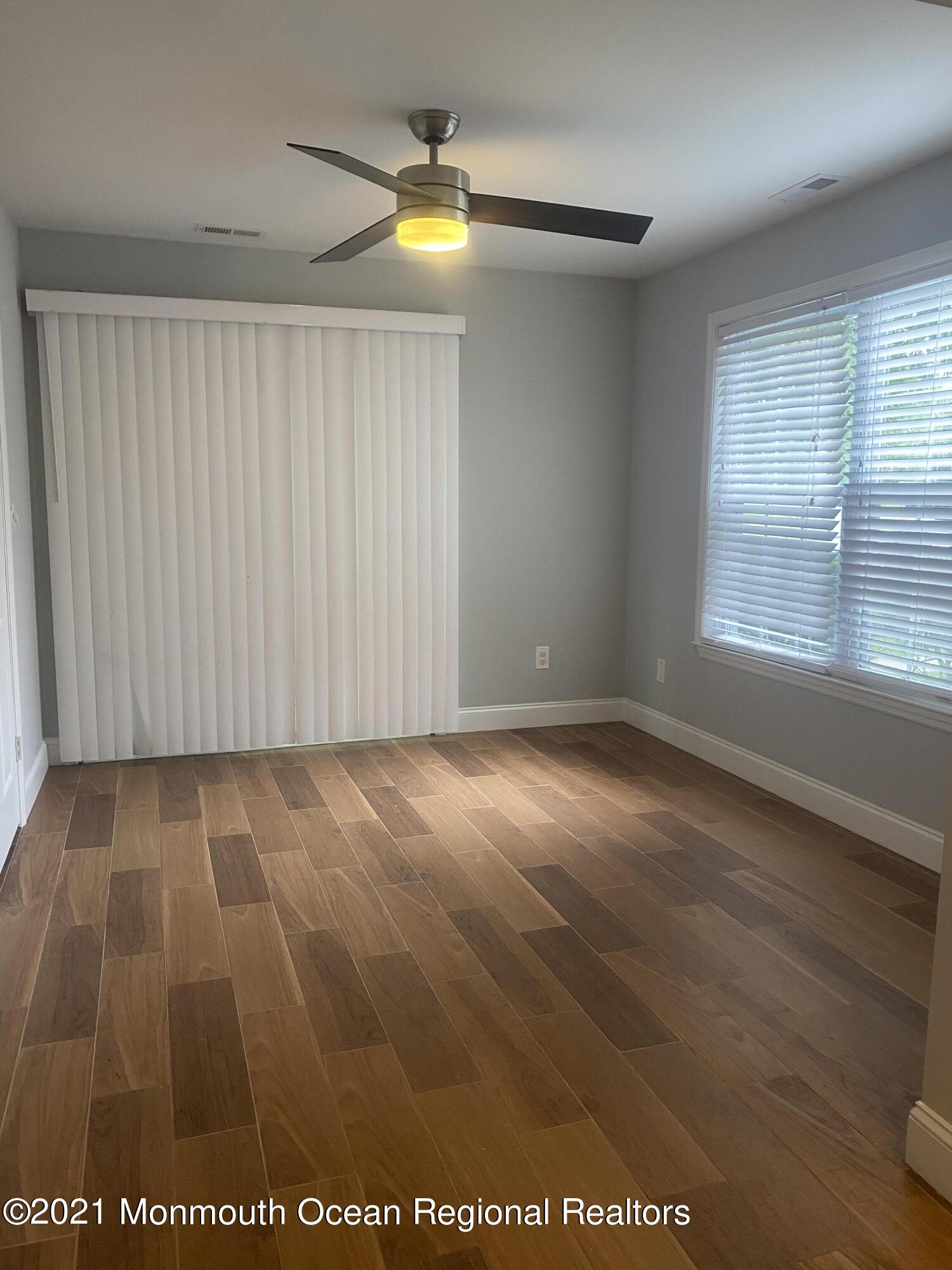 506 Harding Road, Unit 3 Freehold, NJ 07728 - Photo 6 of 18 an empty room with a window