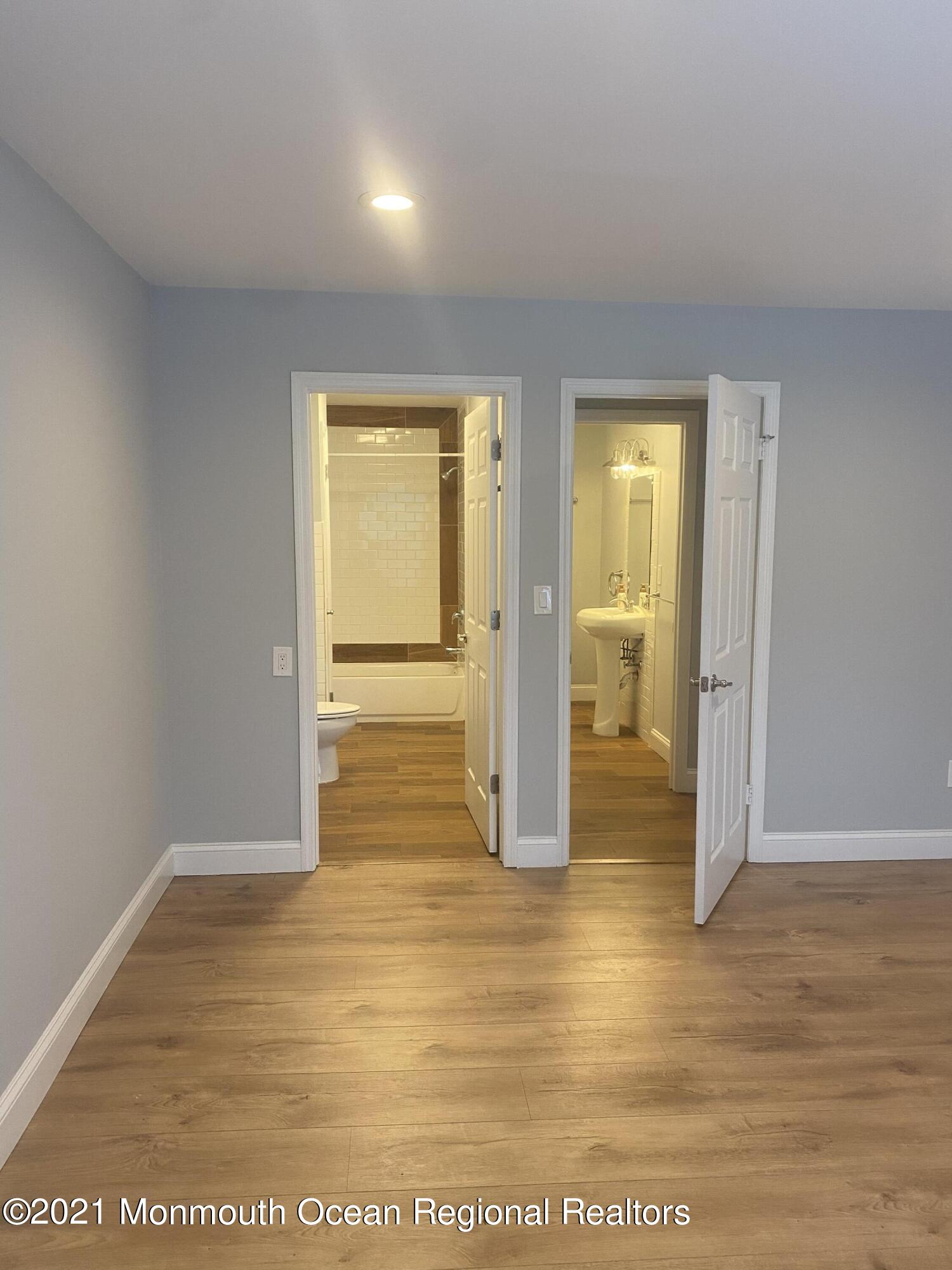 506 Harding Road, Unit 3 Freehold, NJ 07728 - Photo 9 of 18 a view of empty room with wooden floor