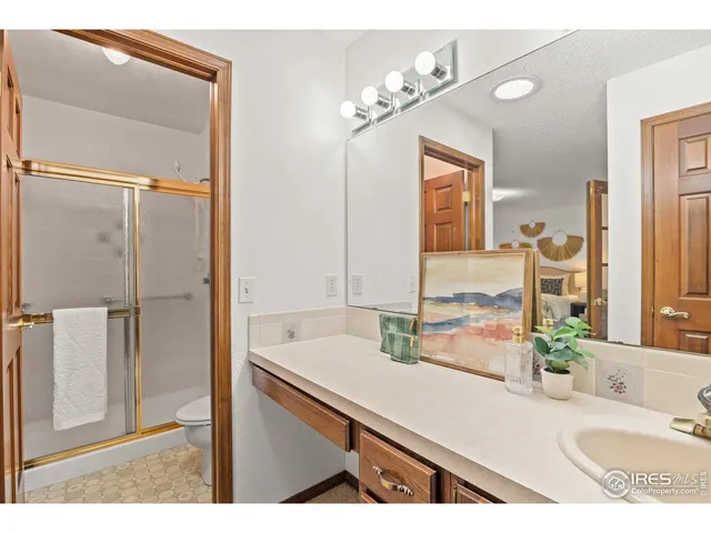 a bathroom with a sink vanity and a mirror