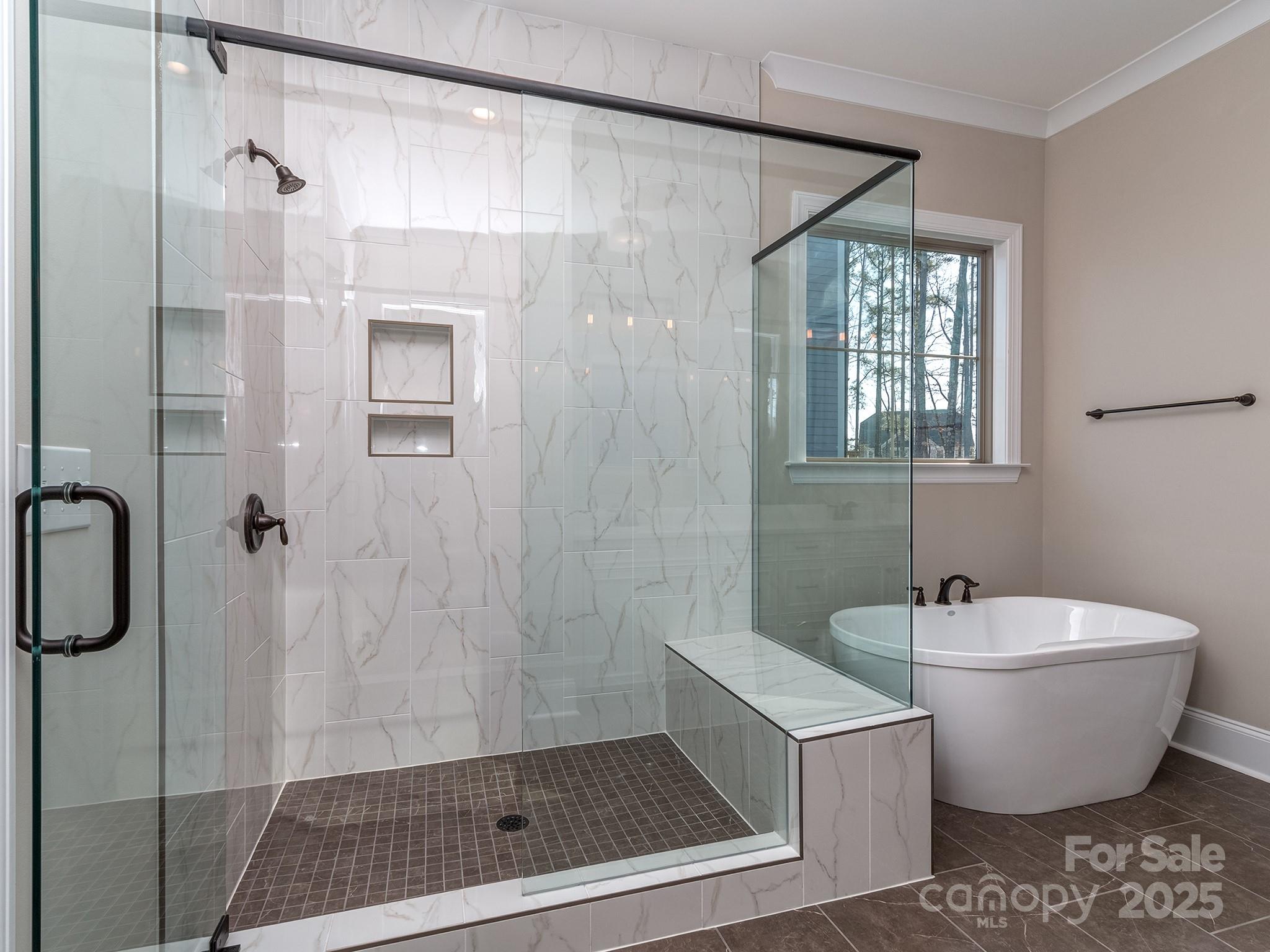 11055 Holiday Cove Lane Tega Cay, SC 29708 - Photo 14 of 39 a bathroom with a bathtub and shower