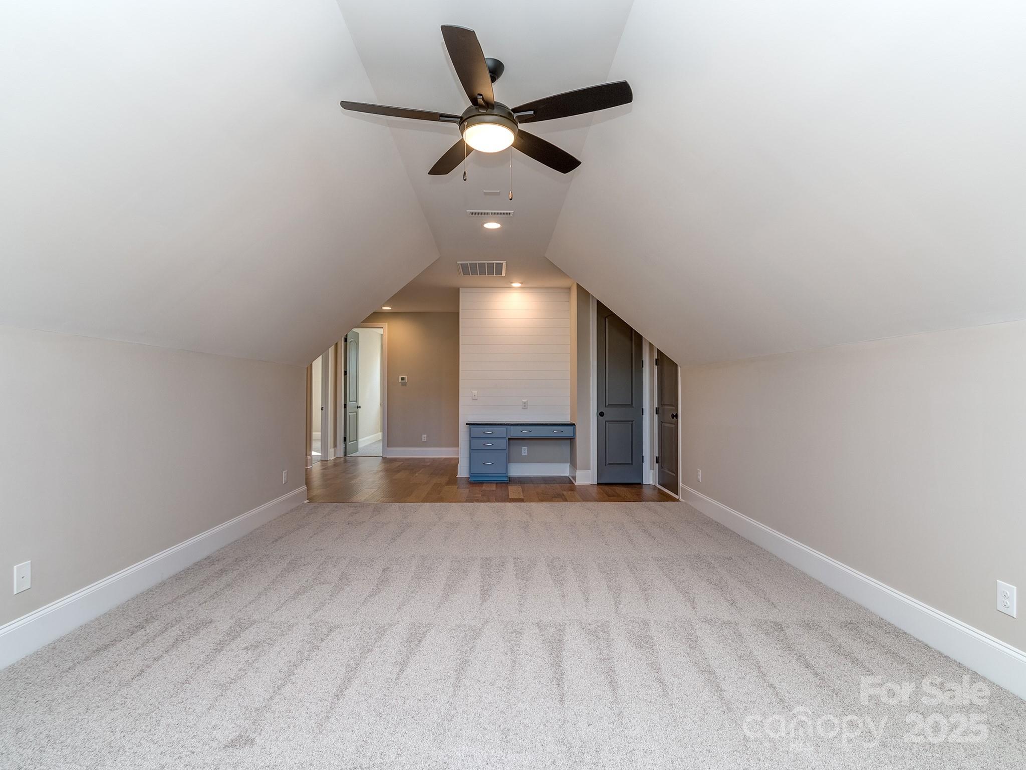 11055 Holiday Cove Lane Tega Cay, SC 29708 - Photo 20 of 39 an empty room with ceiling fan and windows