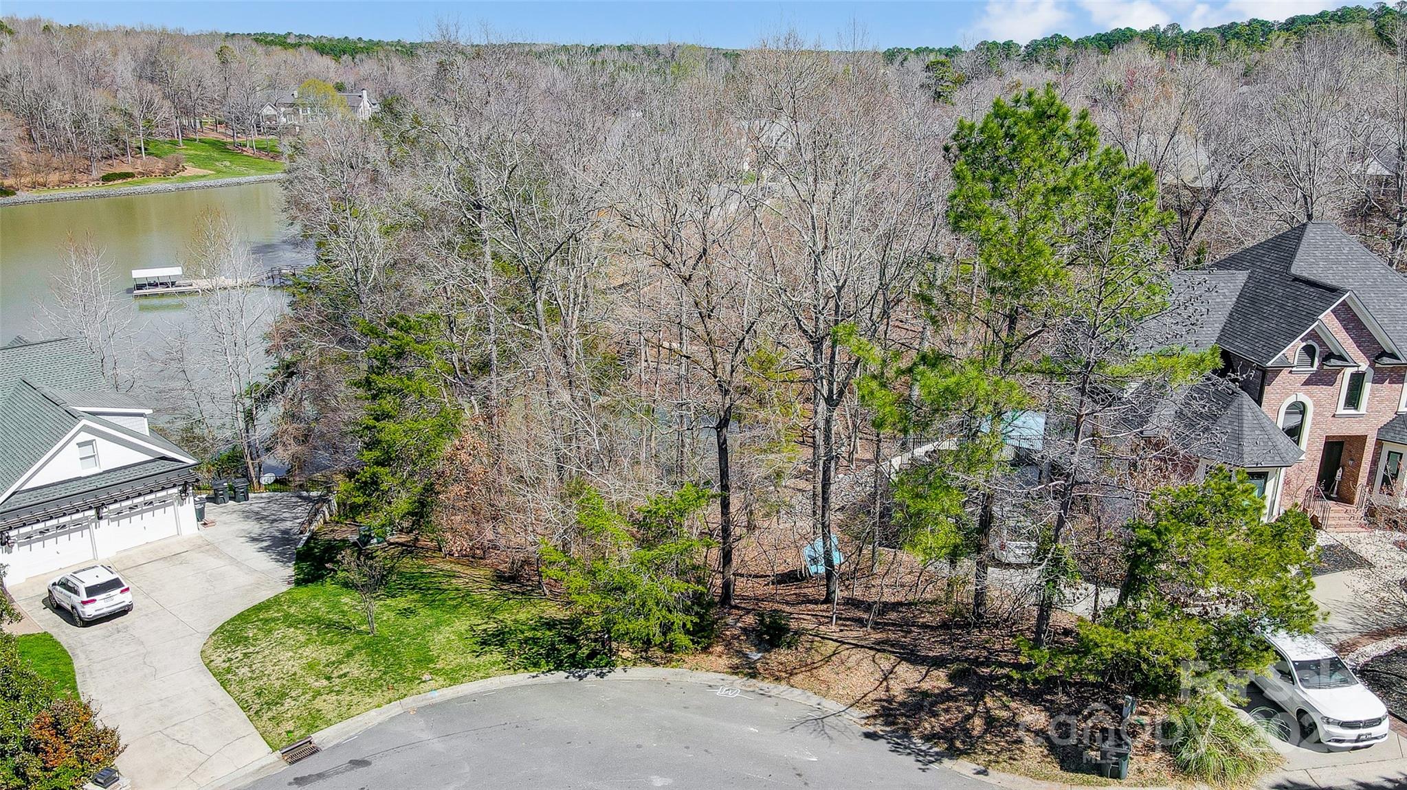 11055 Holiday Cove Lane Tega Cay, SC 29708 - Photo 31 of 39 an aerial view of a house with a yard and lake view