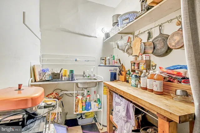 a utility room with multiple dryer and washer