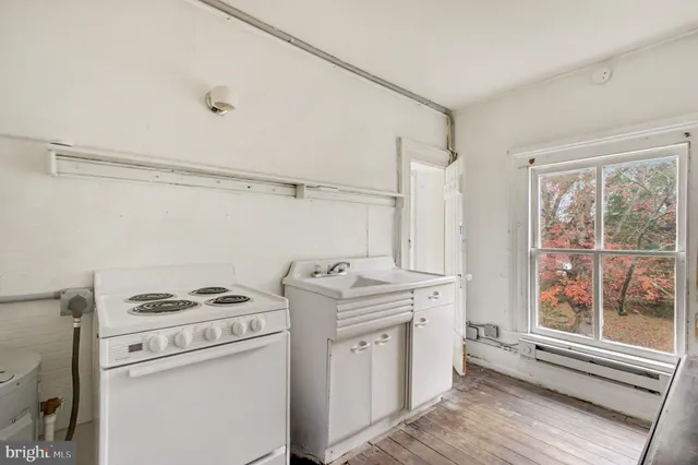 a view of storage and utility room with washer and dryer