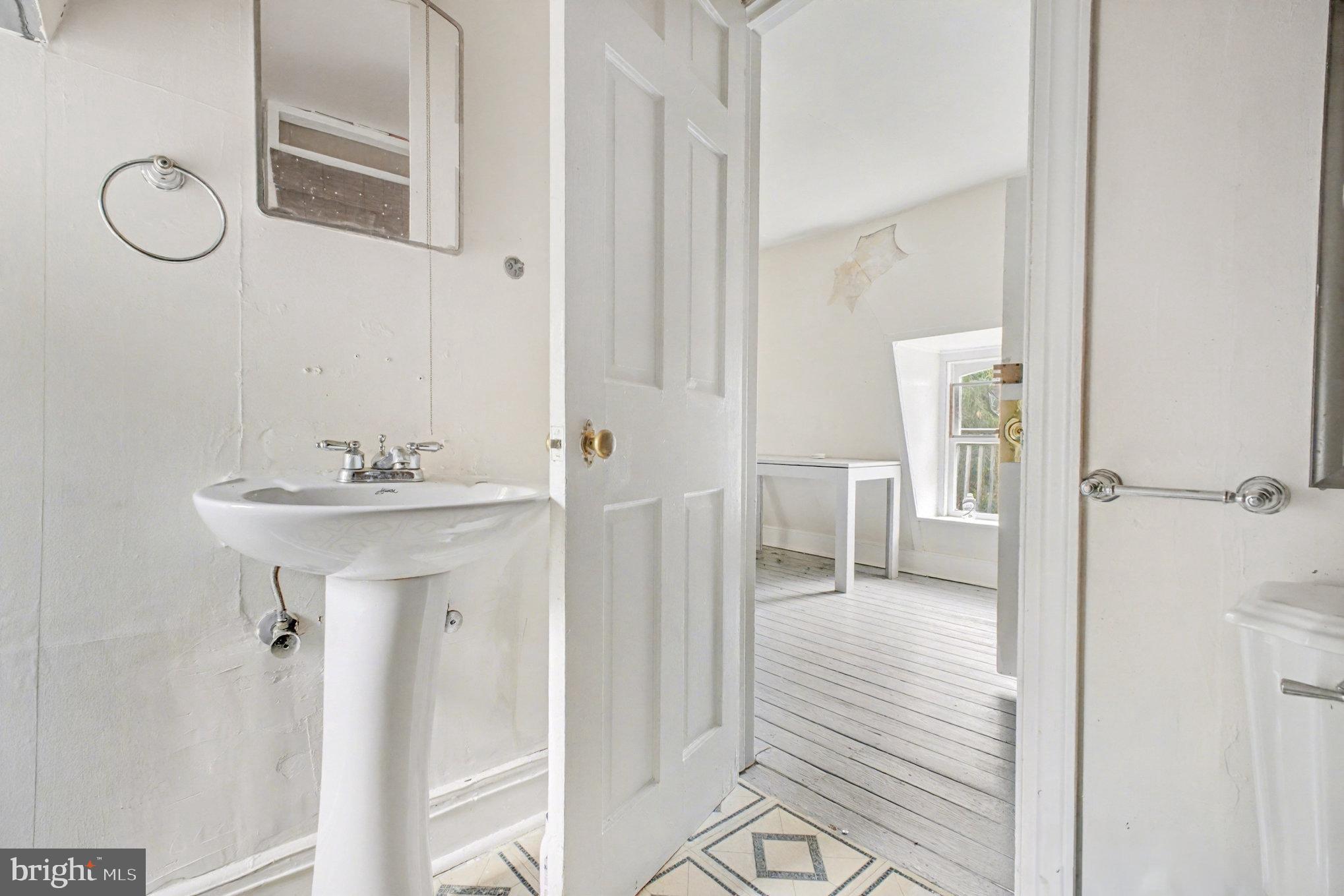 900 Ficklen Road Fredericksburg, VA 22405 - Photo 26 of 46 a bathroom with a sink a mirror and shower