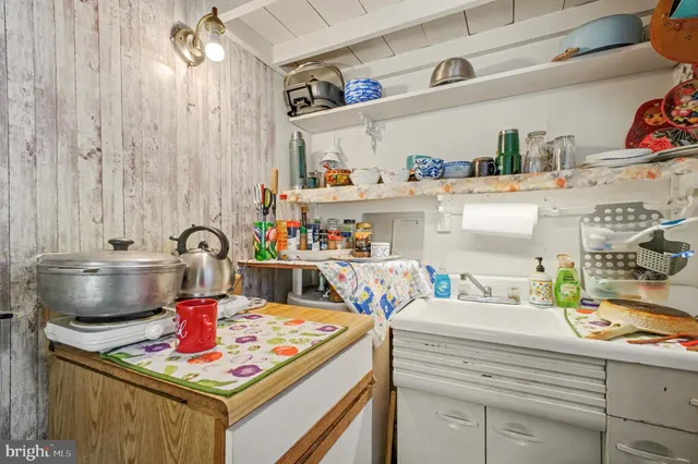 a kitchen with a stove and cabinets