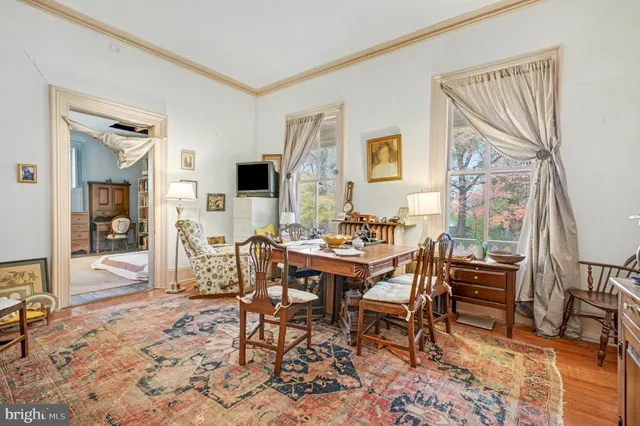 a view of a livingroom with furniture and a window