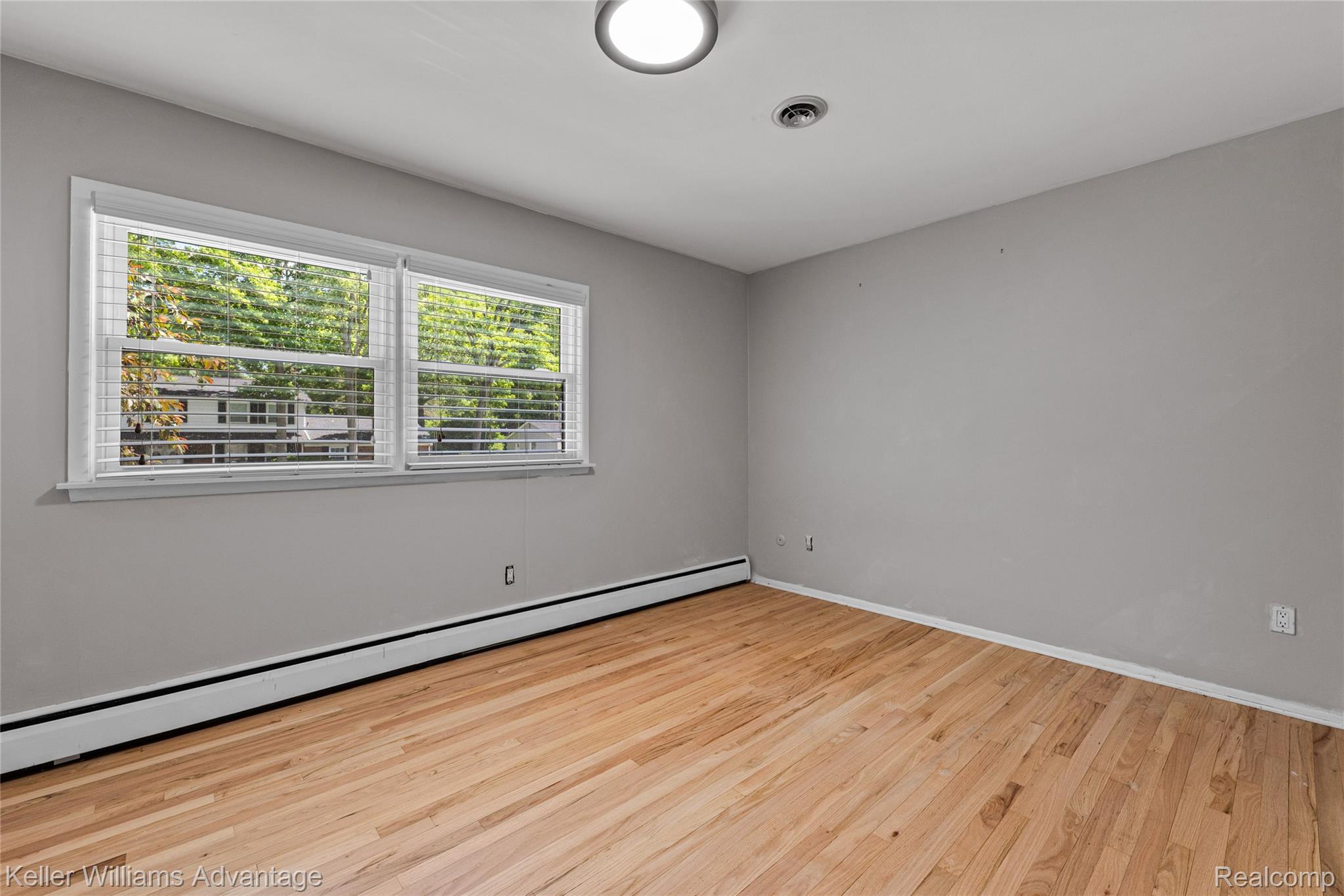 5722 Raven Road Bloomfield Hills, MI 48301 - Photo 27 of 34 Room featuring light wood flooring and neutral wall tones