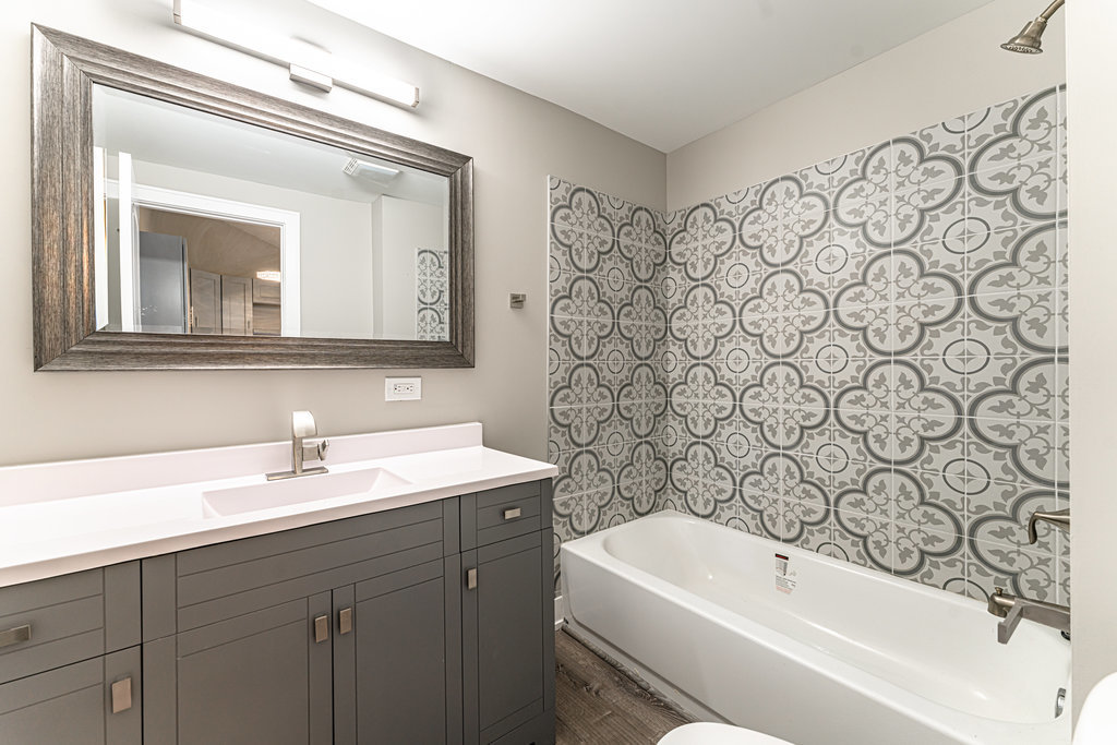 2330 121st Street Blue Island, IL 60406 - Photo 16 of 33 a bathroom with a sink a toilet and a mirror