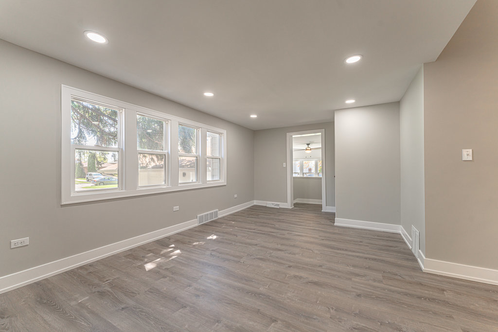 2330 121st Street Blue Island, IL 60406 - Photo 19 of 33 an empty room with wooden floor and windows