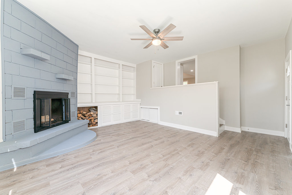 2330 121st Street Blue Island, IL 60406 - Photo 23 of 33 a view of an empty room with a fireplace and a window