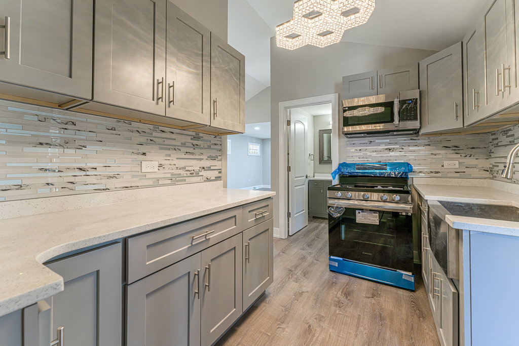2330 121st Street Blue Island, IL 60406 - Photo 6 of 33 a kitchen with stainless steel appliances a stove cabinets and a sink