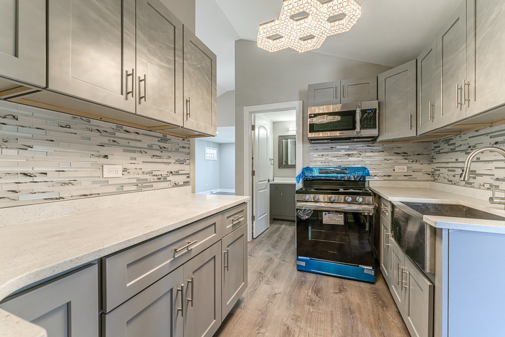 2330 121st Street Blue Island, IL 60406 - Photo 7 of 33 a kitchen with stainless steel appliances a stove microwave and refrigerator