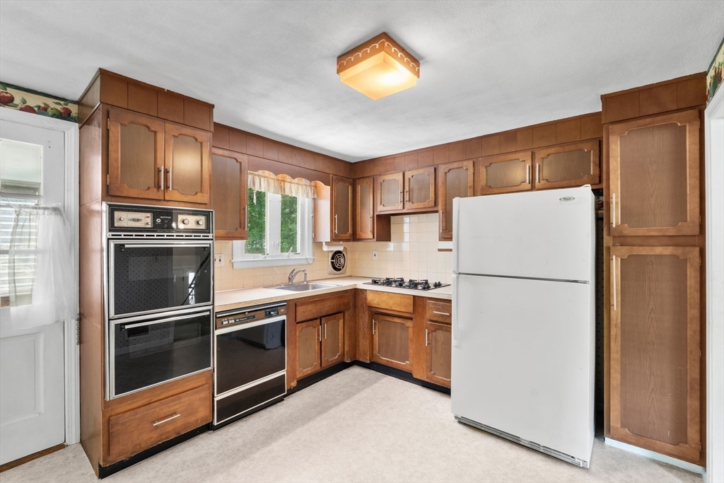 348 Belknap Road Framingham, MA 01701 - Photo 9 of 35 a kitchen with stainless steel appliances a refrigerator sink and microwave