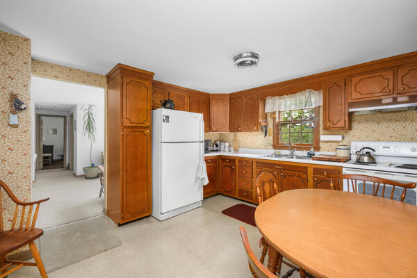 59 Beverly Road West Yarmouth, MA 02673 - Photo 19 of 33 a kitchen with a refrigerator and a sink