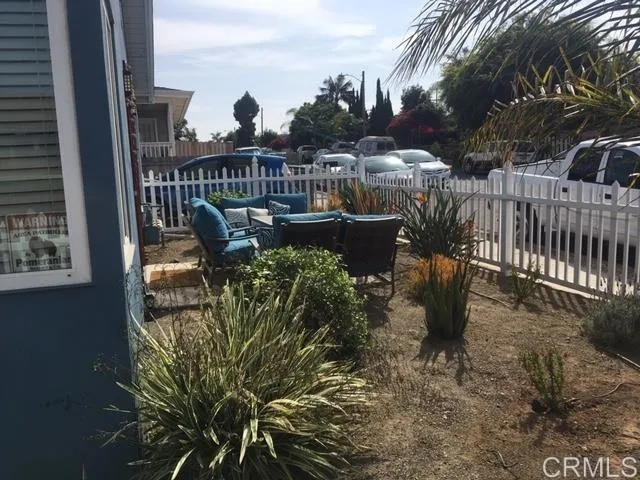 1402 Dubuque Street Oceanside, CA 92058 - Photo 16 of 21 a view of a back yard of the house with a bench
