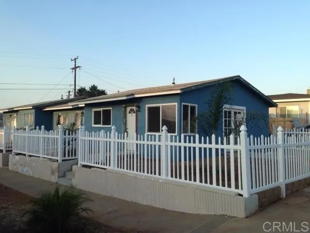 1402 Dubuque Street Oceanside, CA 92058 - Photo 2 of 21 a front view of a house with iron fence