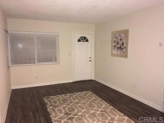 1402 Dubuque Street Oceanside, CA 92058 - Photo 3 of 21 a view of an empty room with a window