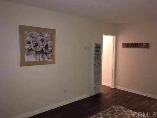 a view of a small space with wooden floor