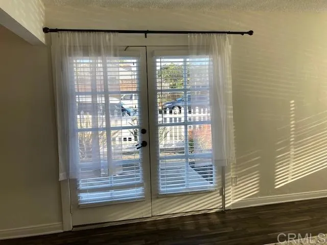 1402 Dubuque Street Oceanside, CA 92058 - Photo 7 of 21 a view of empty room with wooden floor and floor to ceiling window