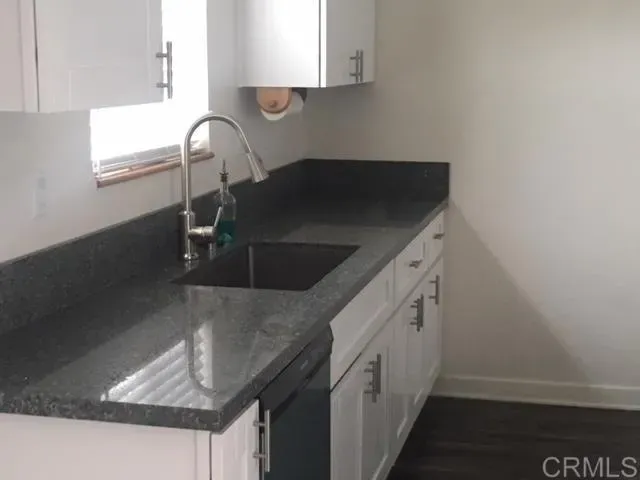 a kitchen with a refrigerator stove and microwave