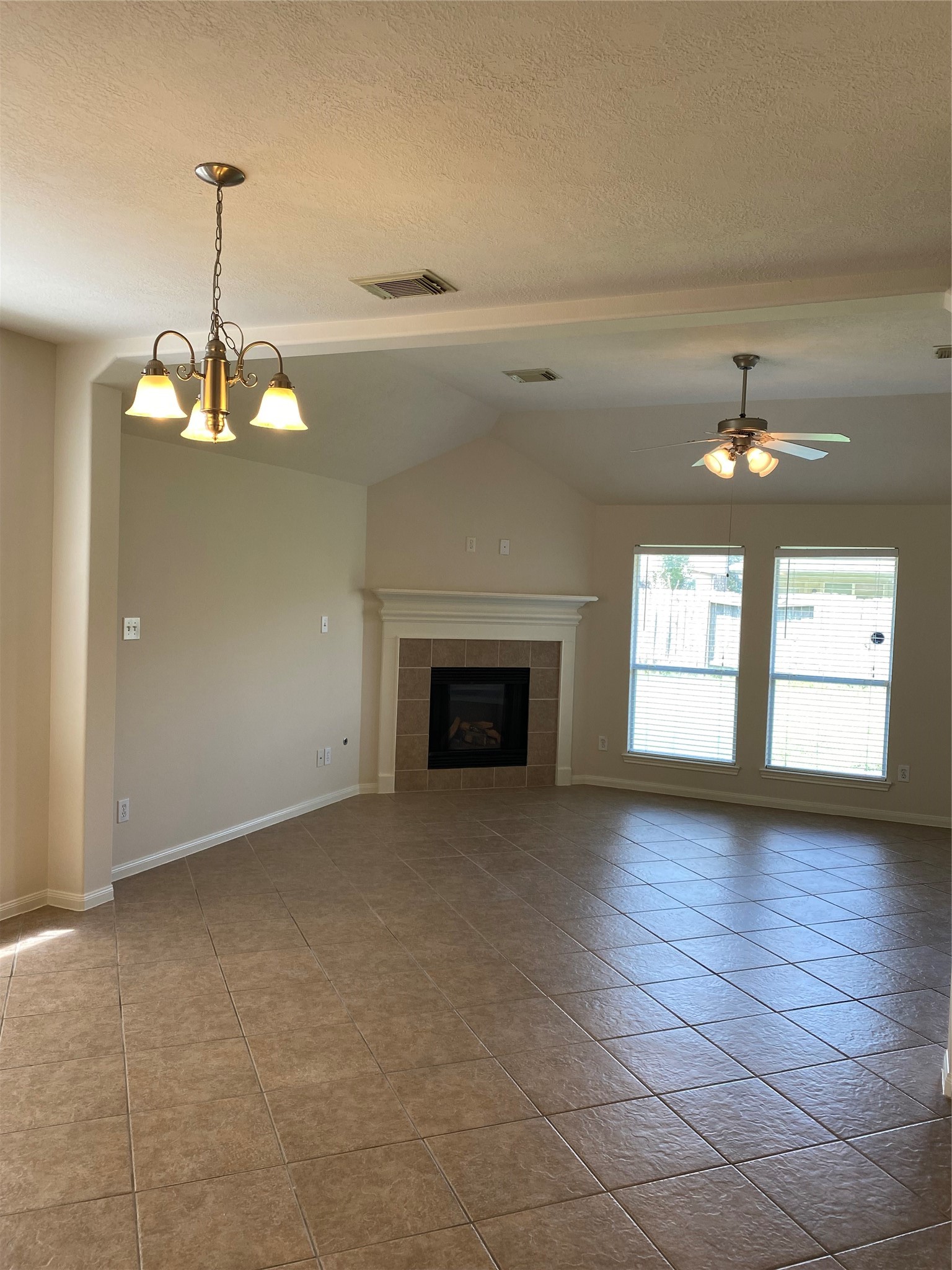 25119 Hazel Ranch Drive Katy, TX 77494 - Photo 5 of 18 Lovely tiled flooring in the Dining and spacious Family room with FP