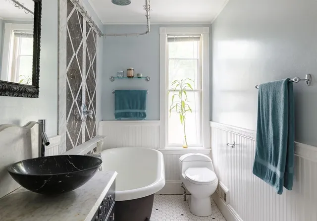 a bathroom with a sink a toilet and a bathtub