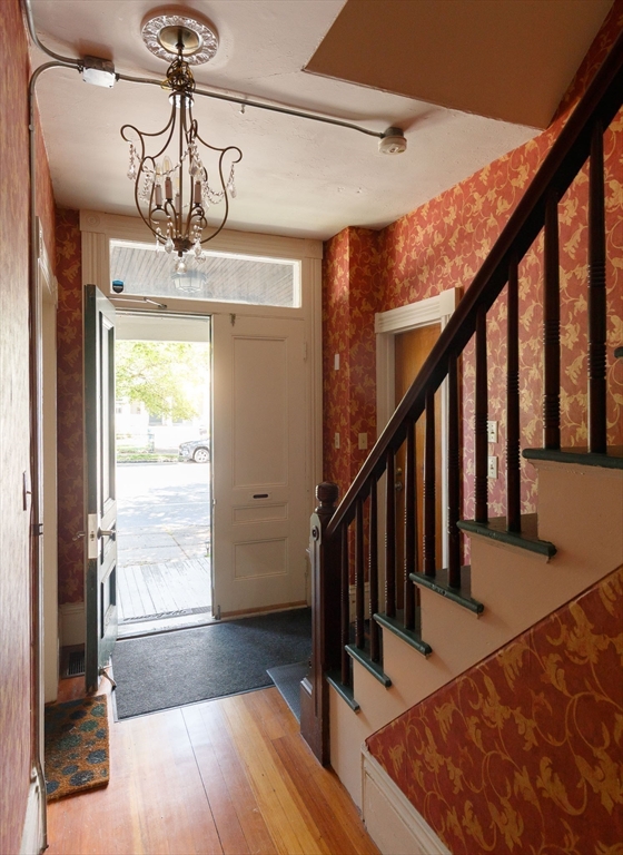 327 Lafayette Street, Unit 2 Salem, MA 01970 - Photo 14 of 22 a view of a hallway with wooden floor and staircase