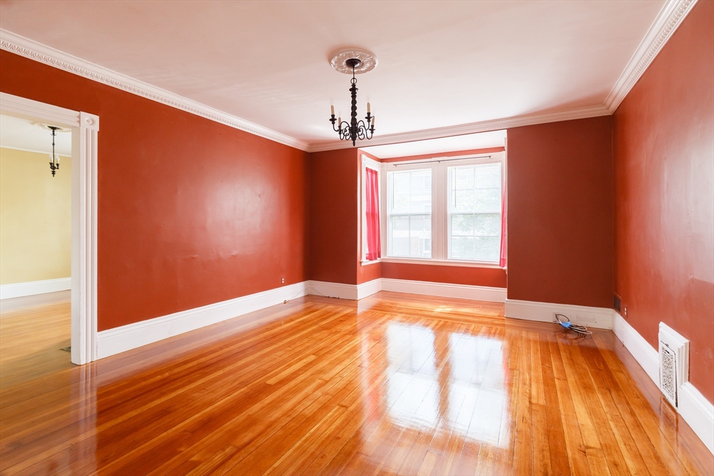 327 Lafayette Street, Unit 2 Salem, MA 01970 - Photo 18 of 22 a view of empty room with wooden floor and fan